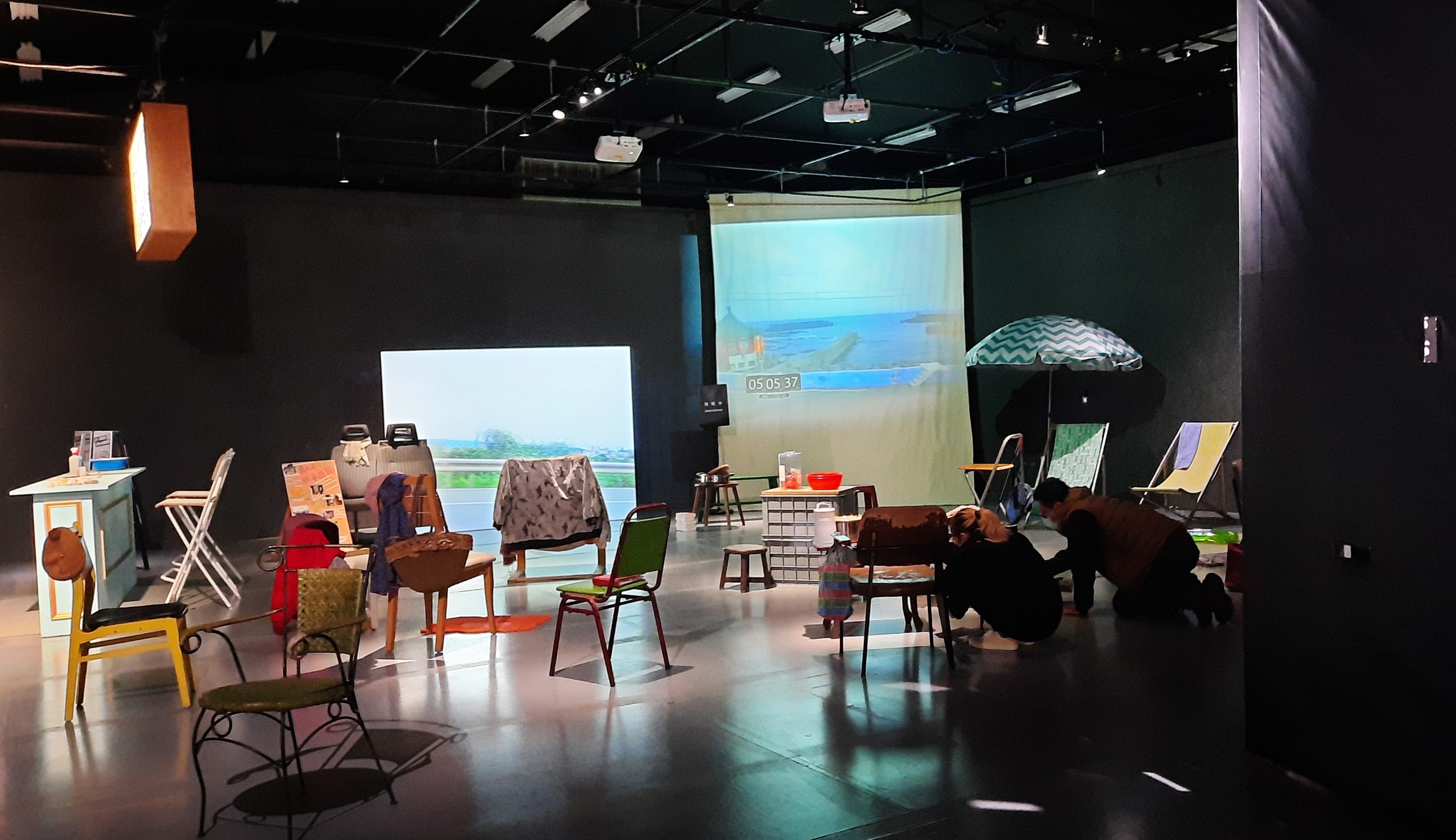 Landscape Window formed by real-time seascape and chairs.